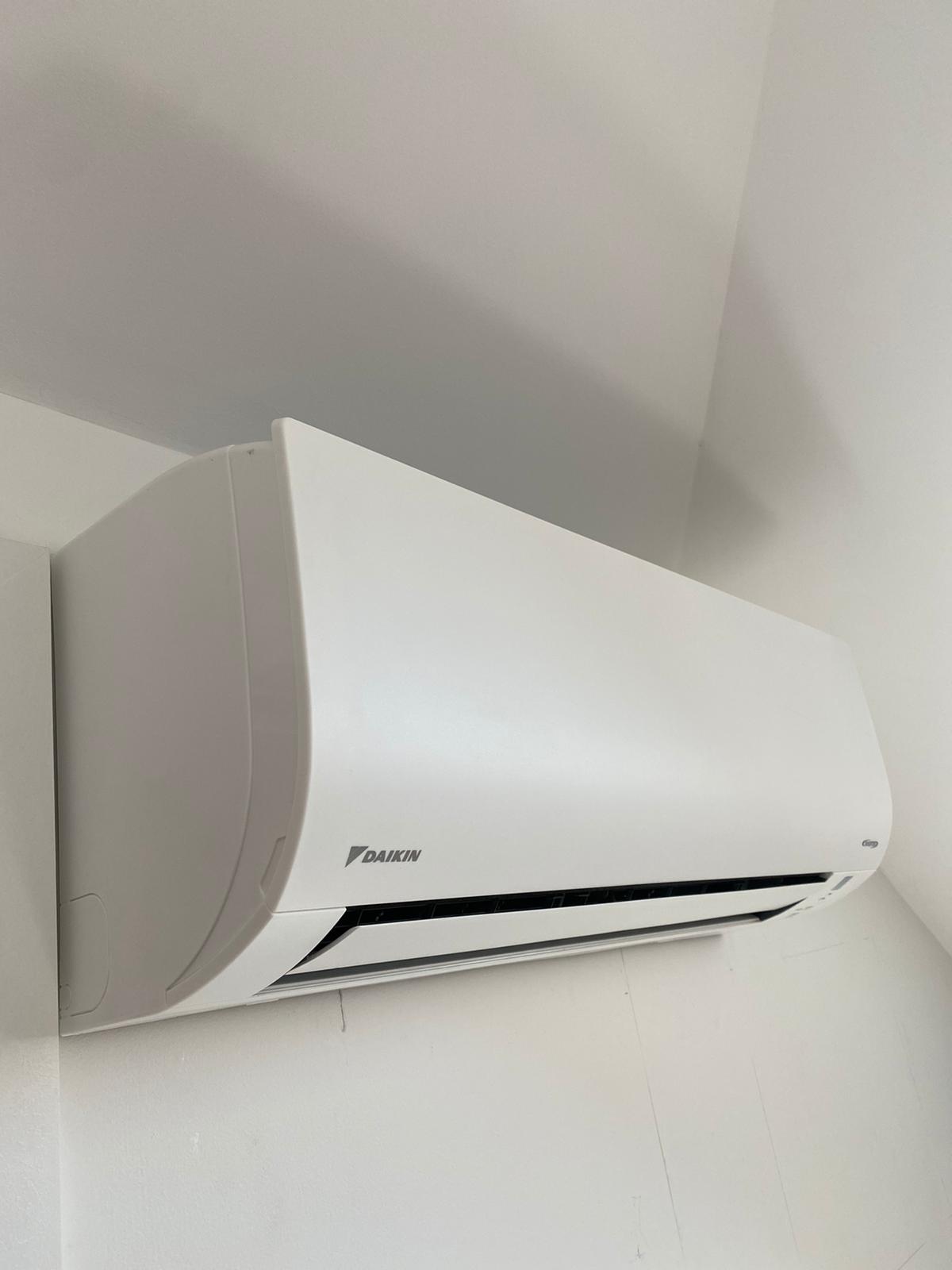 Daikin split system air conditioner installed on wall